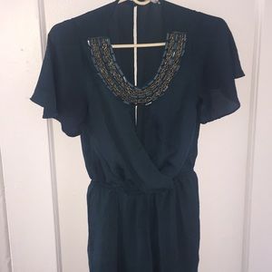 Emerald green jumpsuit with a crystal neckline